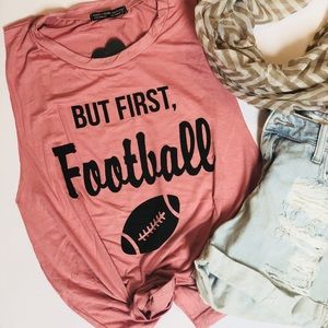 “By first, football” muscle tee